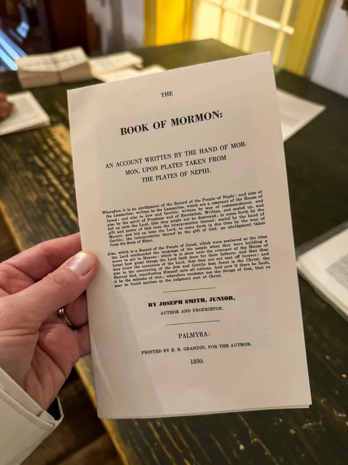 A picture of a replica cover page of the first edition Book of Mormon.