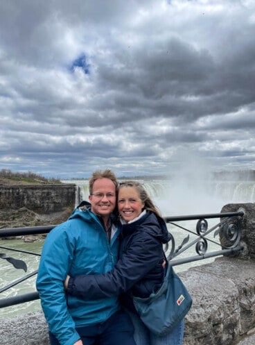 A couple in front of Niagara Falls.