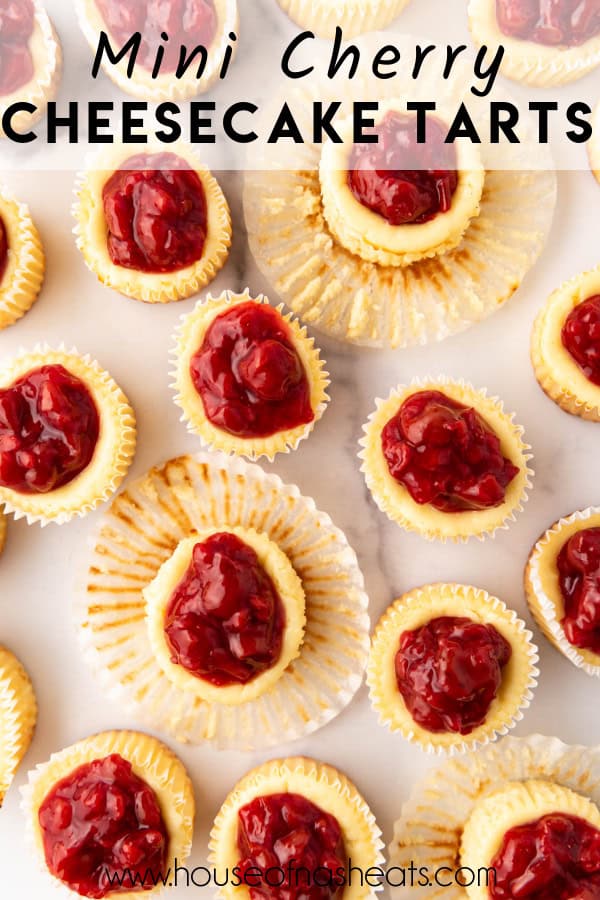 An overhead image of cherry cheesecake tarts with text overlay.