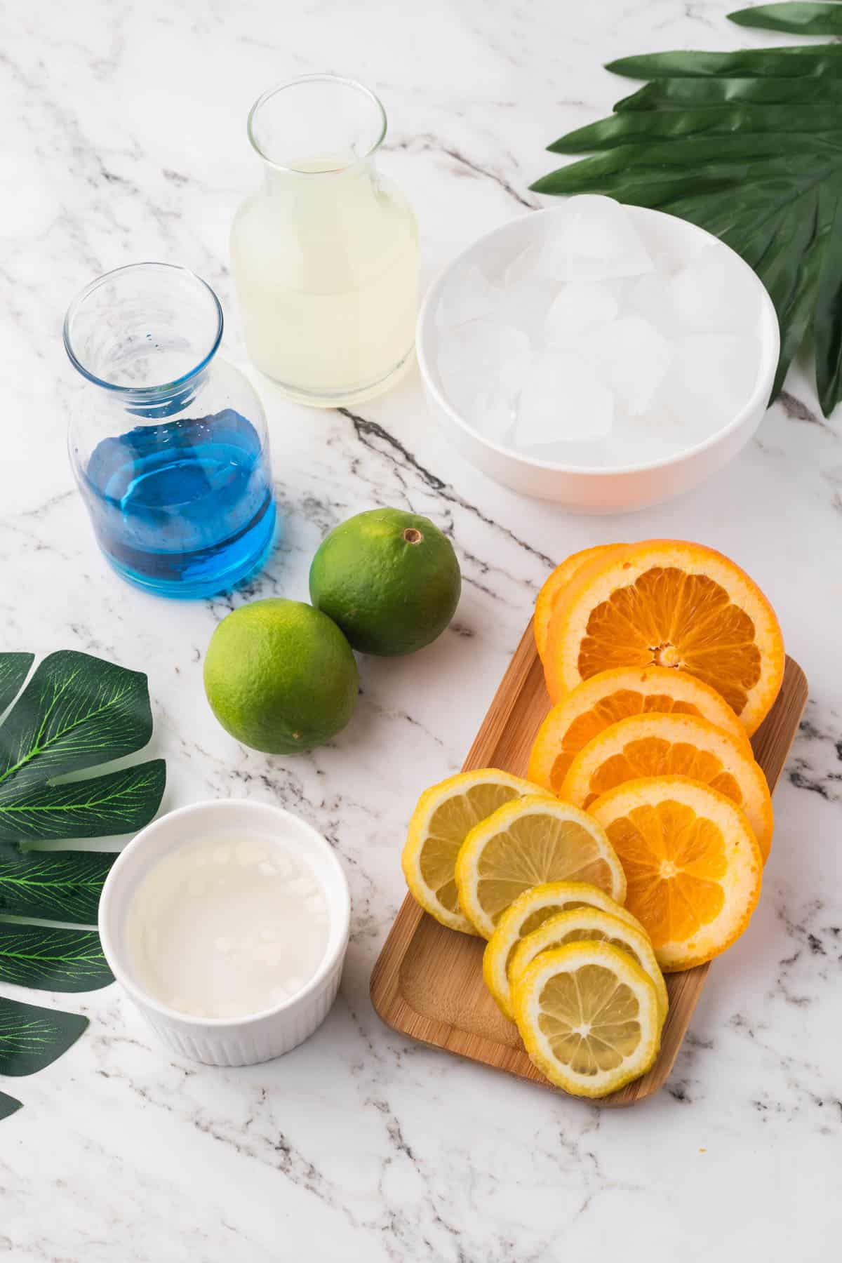 An image of ingredients for making a blue lagoon mocktail.