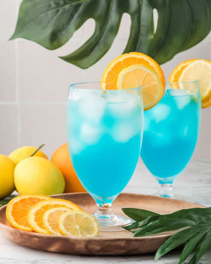 Mocktail glasses filled with a non-alcoholic blue drink.