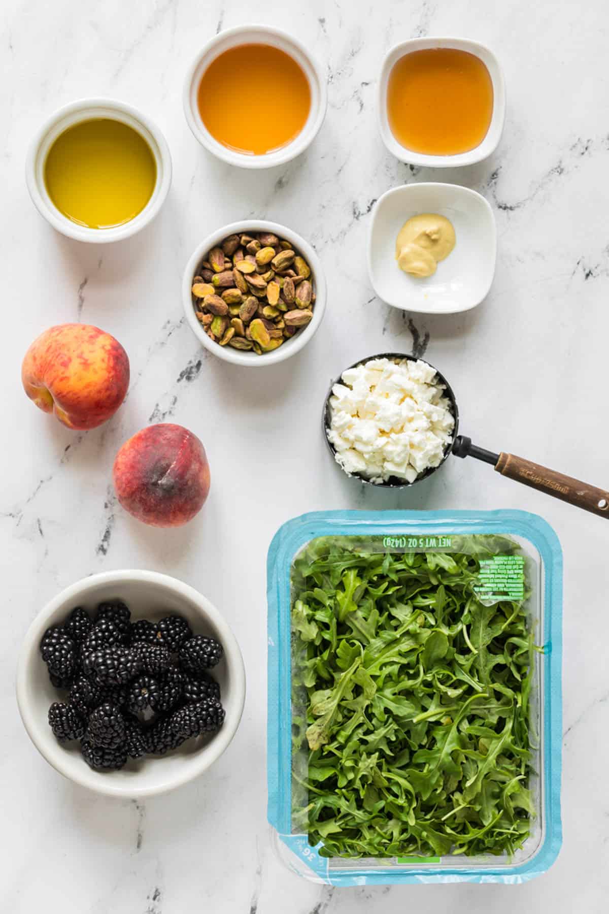 Ingredients for making a grilled peach salad.