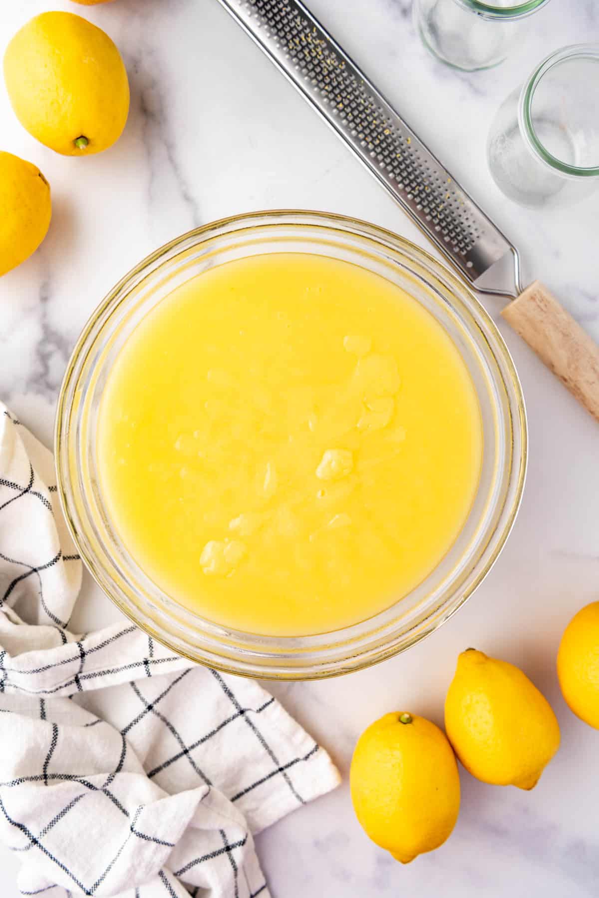 An overhead image of a bowl of lemon pudding.