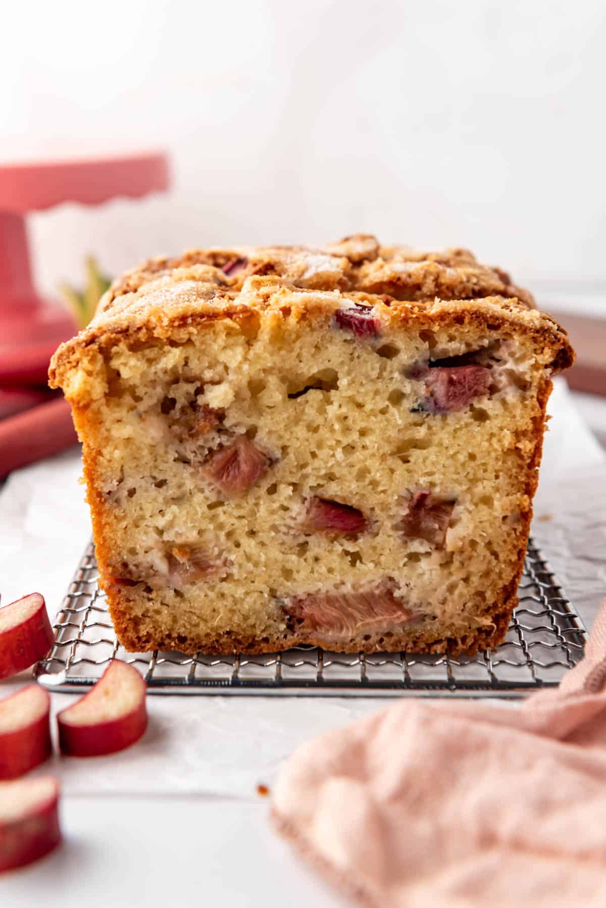 A side image of a sliced loaf of rhubarb bread.