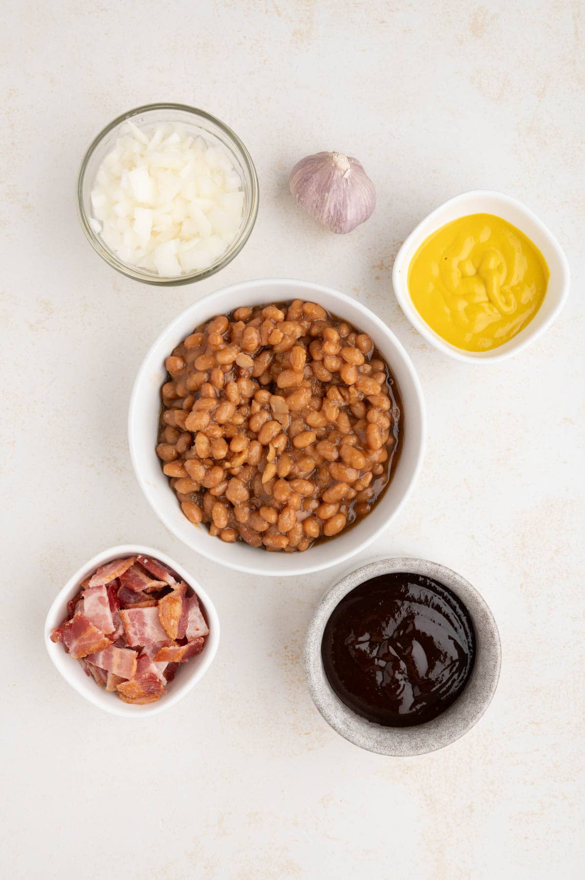 An overhead image of ingredients for slow cooker baked beans.