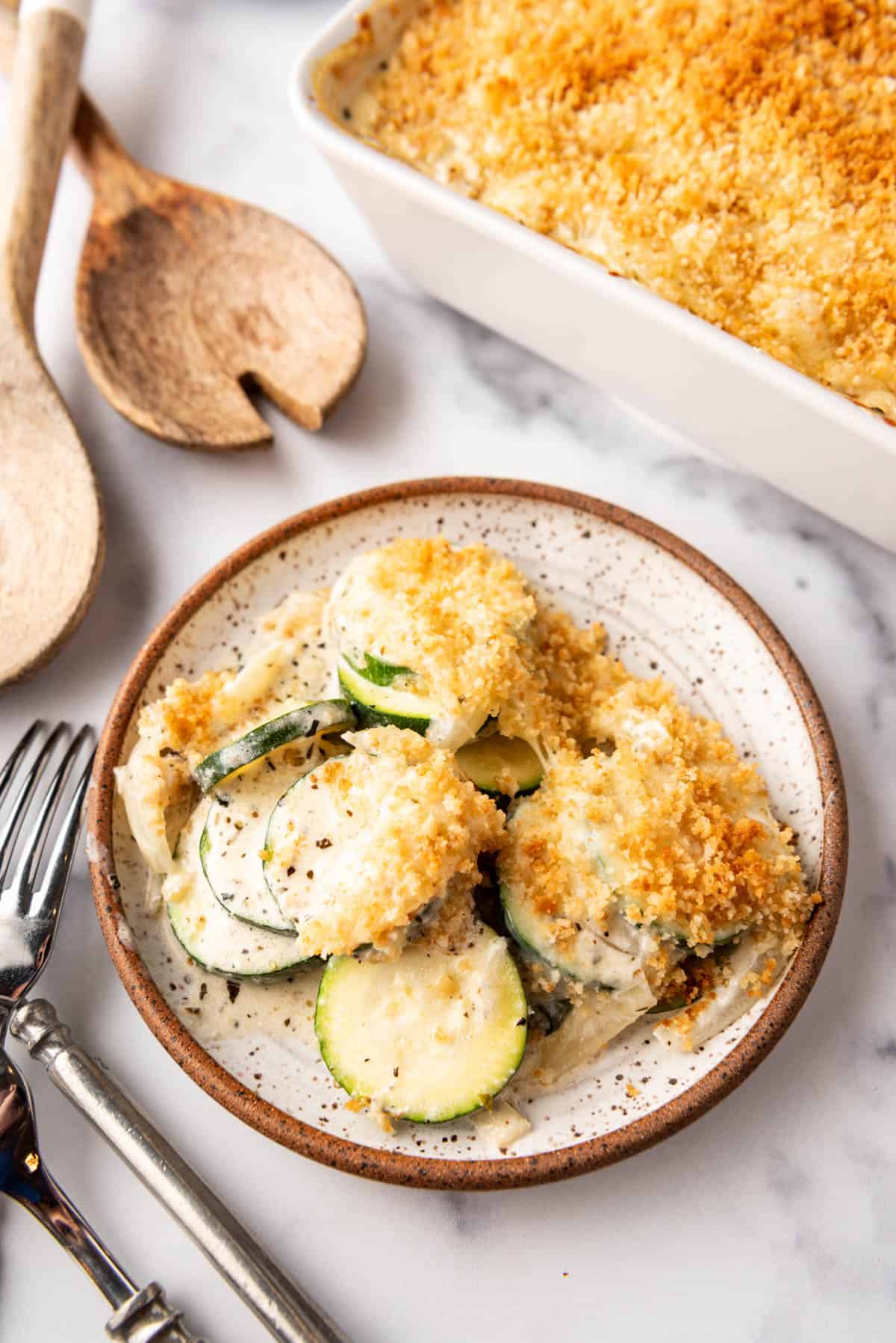 An overhead image of a plate of zucchini casserole with breadcrumb topping.