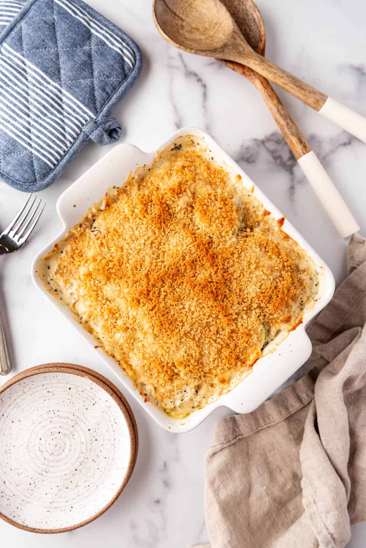 An overhead image of a pan of zucchini casserole with breadcrumb topping.