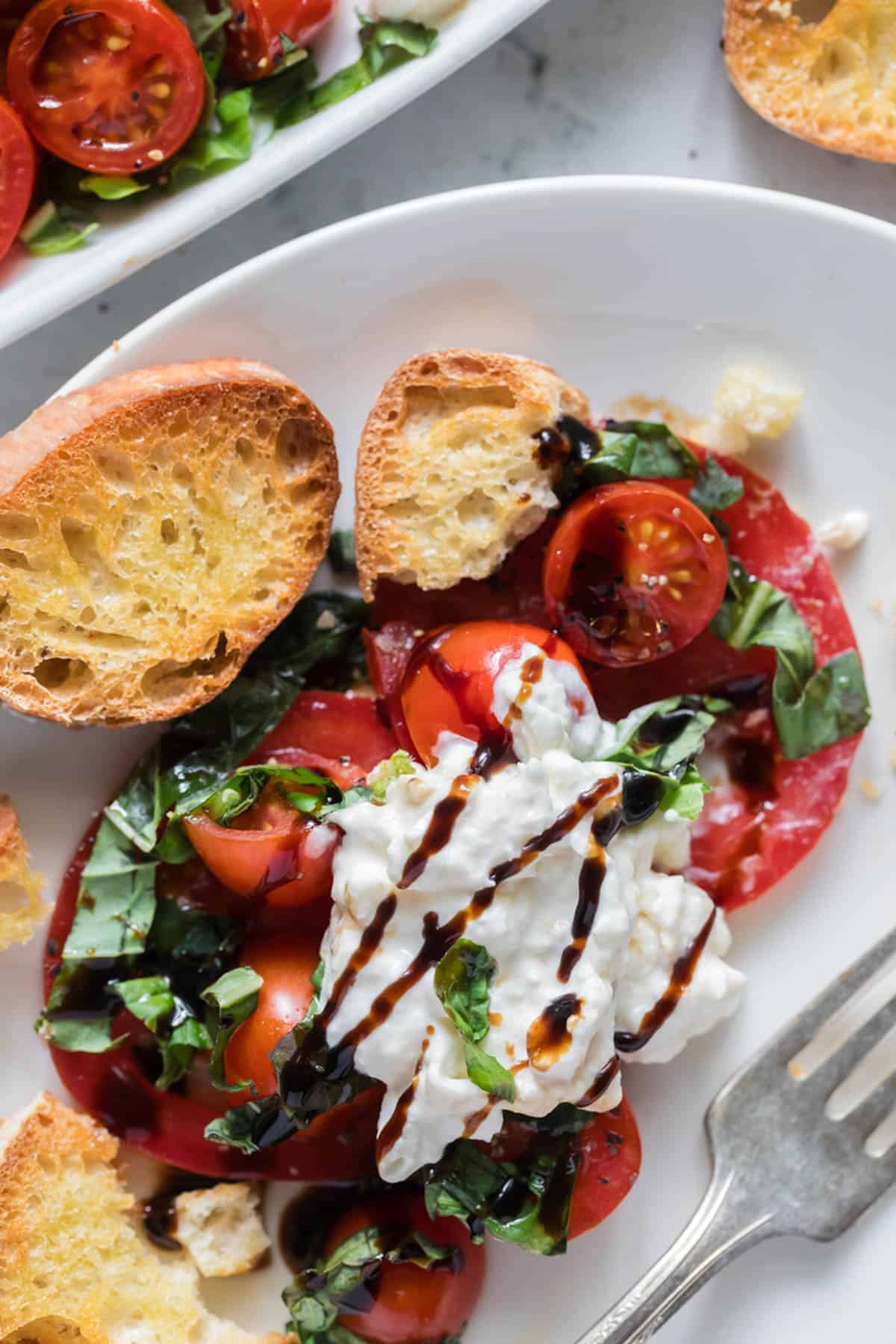 Burrata caprese on small toasts.