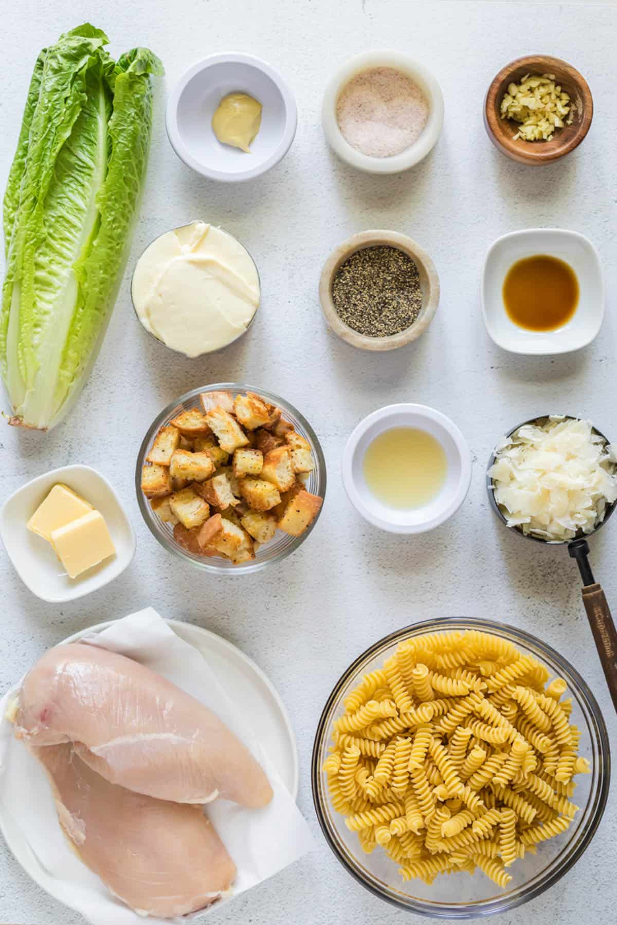 Ingredients for chicken caesar pasta salad.