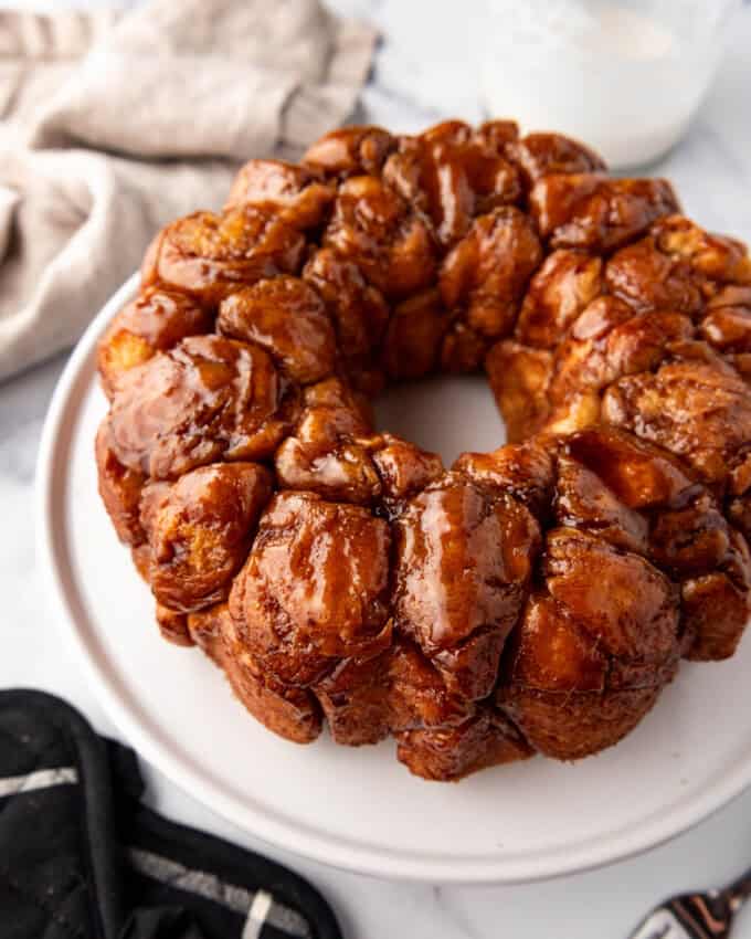 Monkey bread inverted onto a white cake plate.