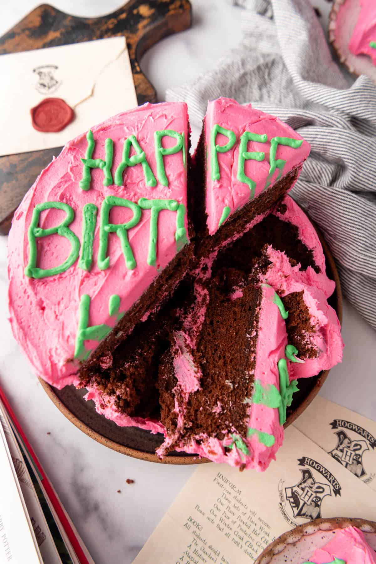 An overhead image of a Harry Potter birthday cake that has been sliced.