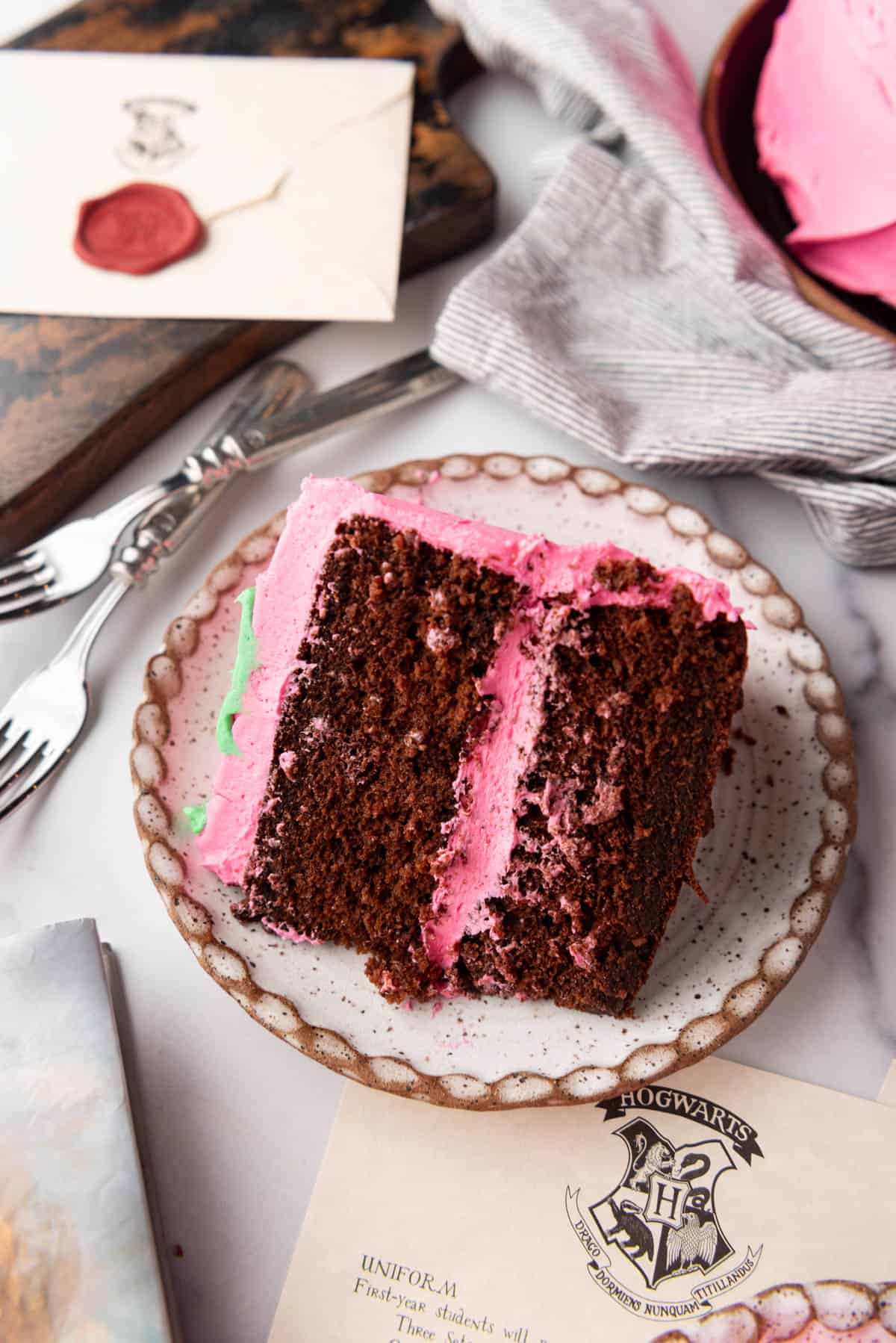 A slice of birthday cake on a plate.