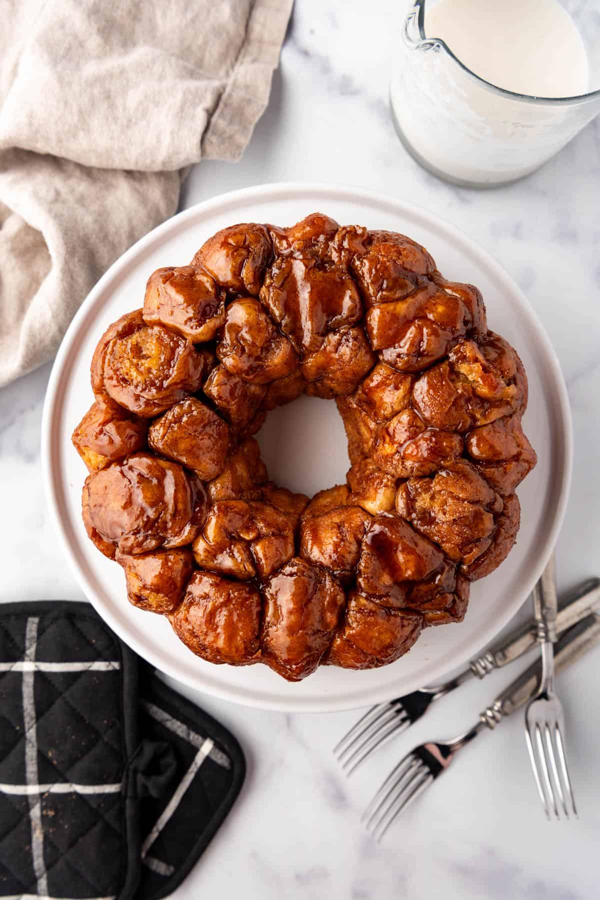 Monkey bread inverted onto a white cake plate.