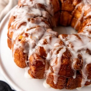 An image of homemade monkey bread on a white plate.