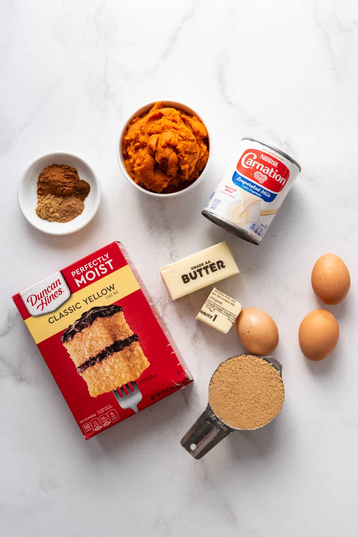 Ingredients for making pumpkin dump cake.