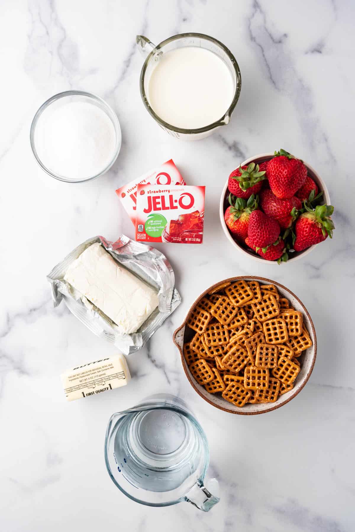 An overhead image of ingredients for making strawberry pretzel salad.