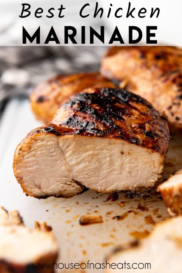 A grilled marinated chicken breast sliced in half with text overlay.