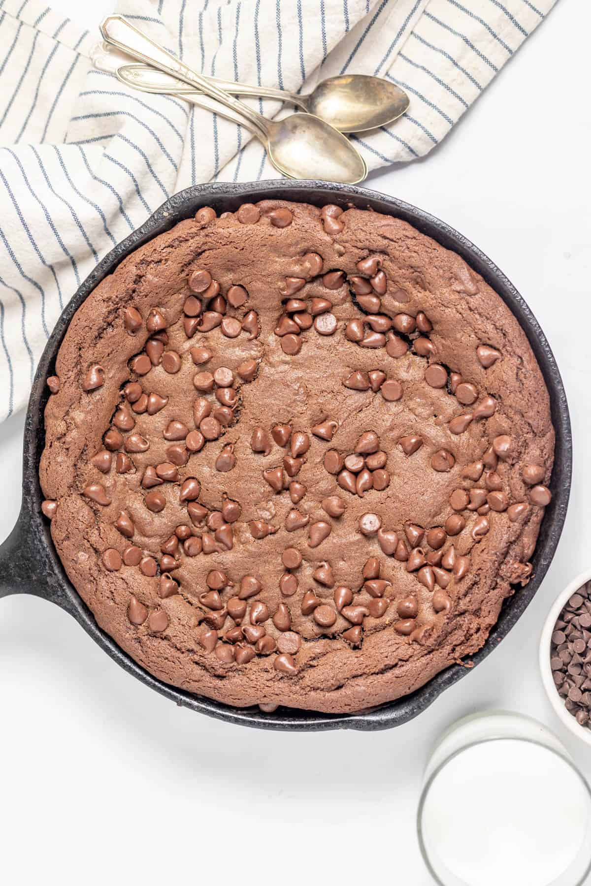 An overhead image of a baked chocolate skillet cookie.