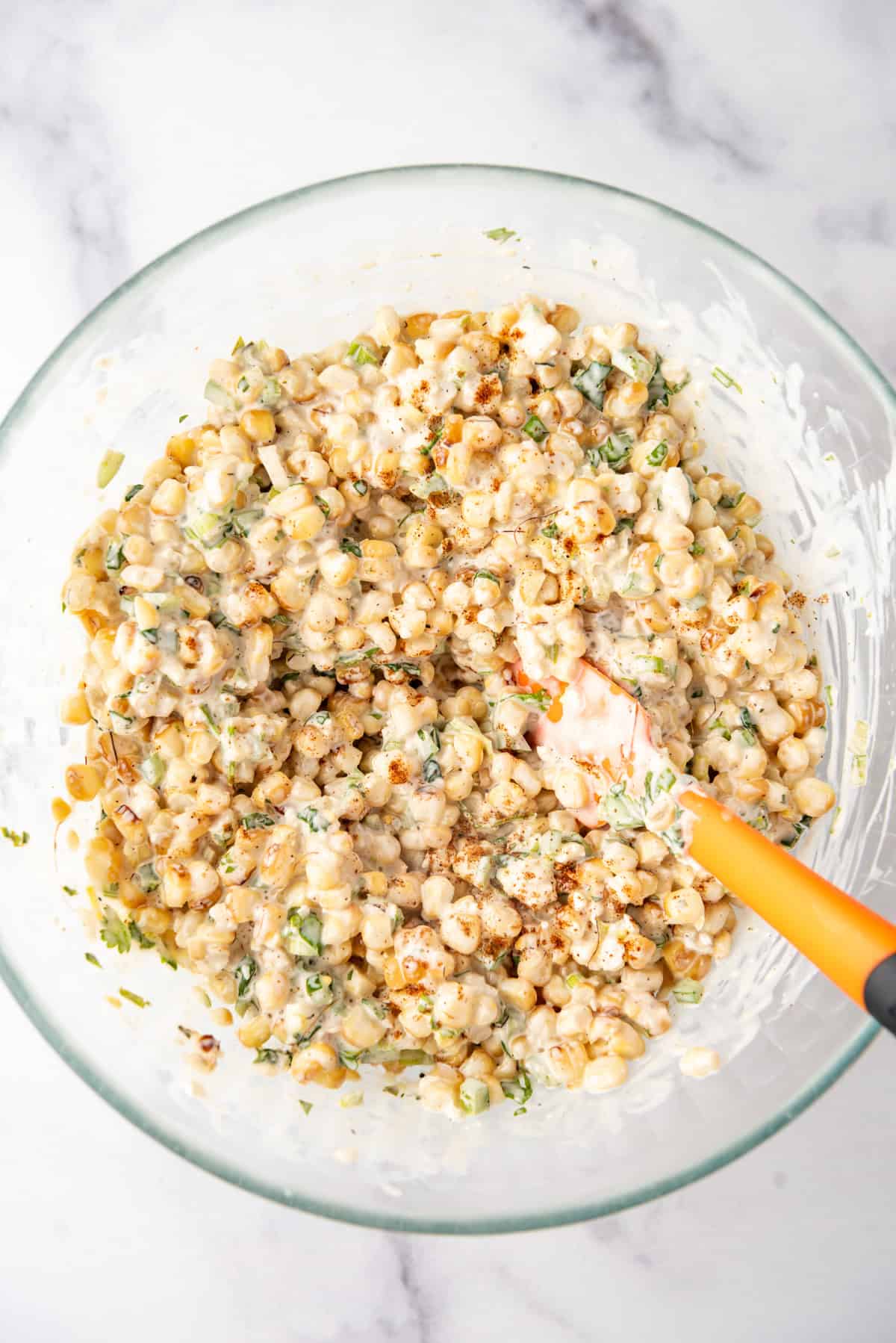 Elote topping for a gourmet cheeseburger.