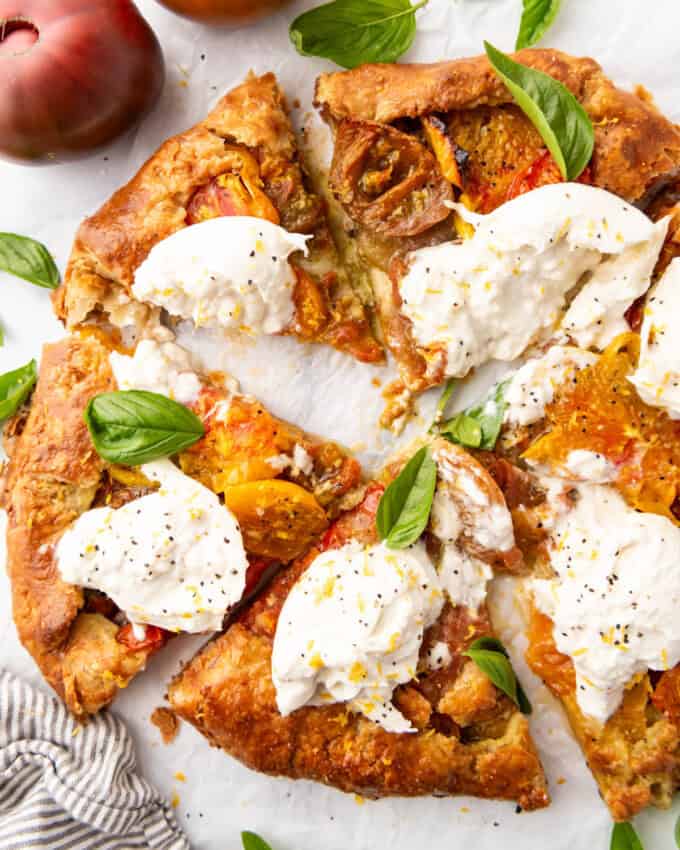 A side view of slices of heirloom tomato galette.