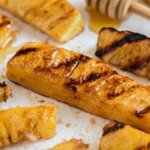 An image of grilled pineapple spears.