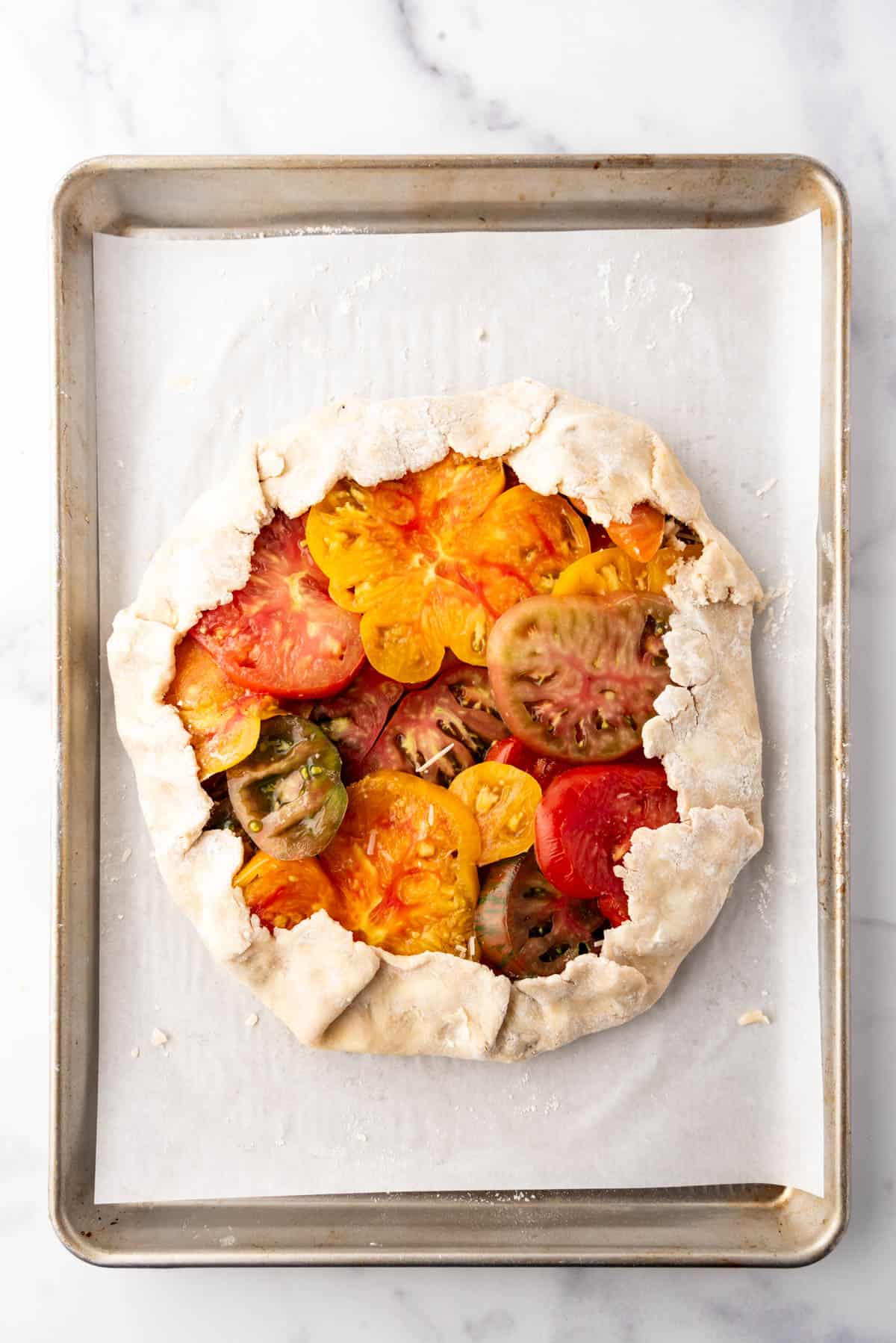 An heirloom tomato galette ready to go into the oven.