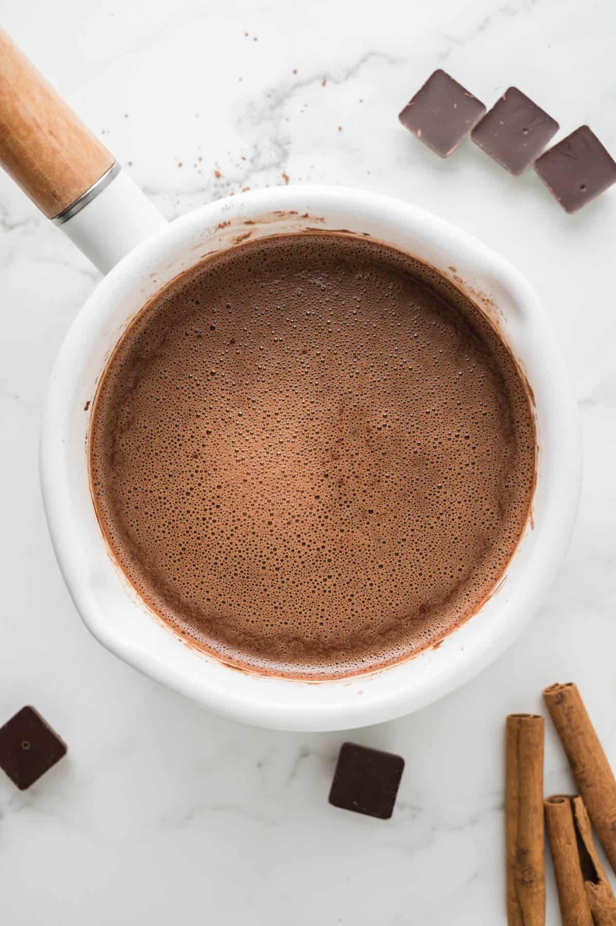 An overhead image of a pot of Mexican hot chocolate.