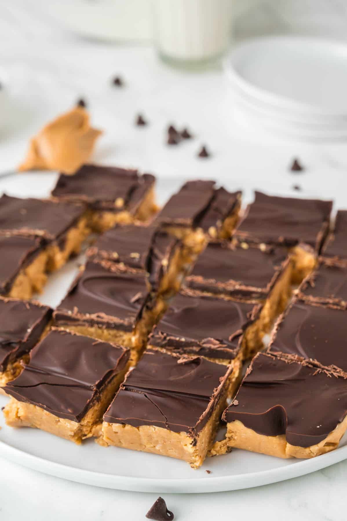 A batch of no-bake peanut butter bars sliced into squares.