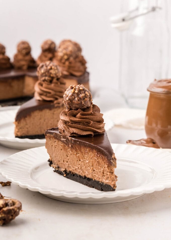 A slice of Nutella cheesecake on a white plate.