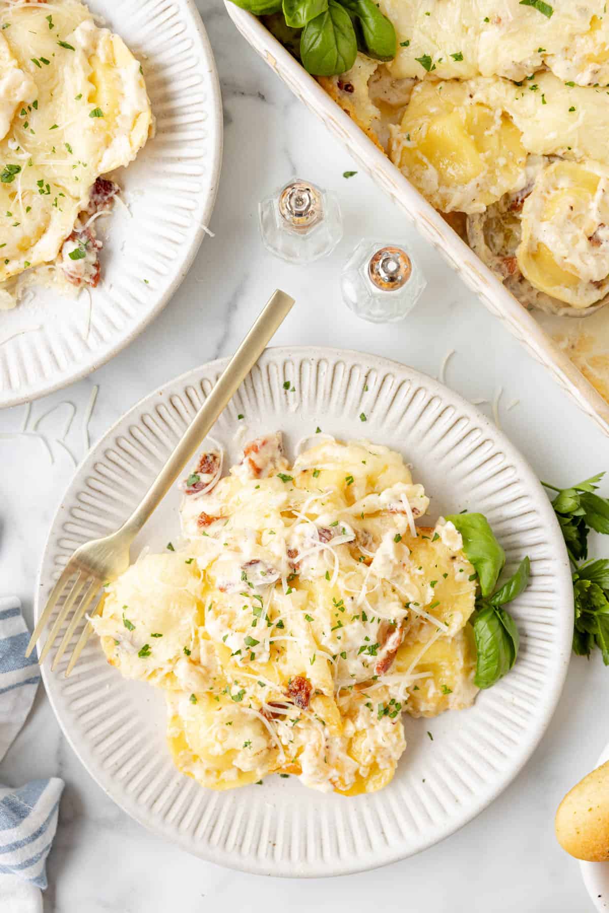 Plates of copycat Olive Garden ravioli carbonara.