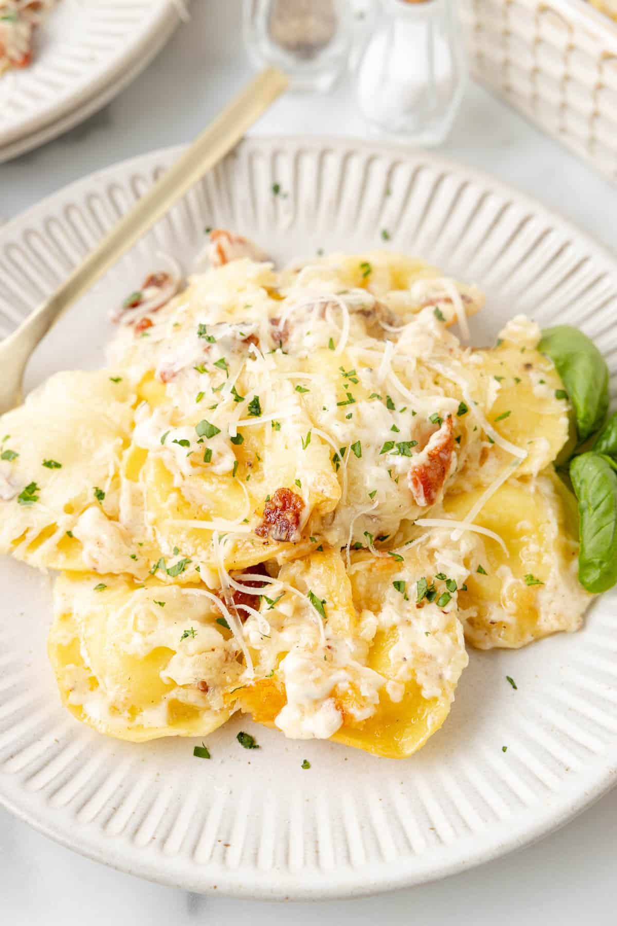 An image of a plate of copycat Olive Garden ravioli carbonara.