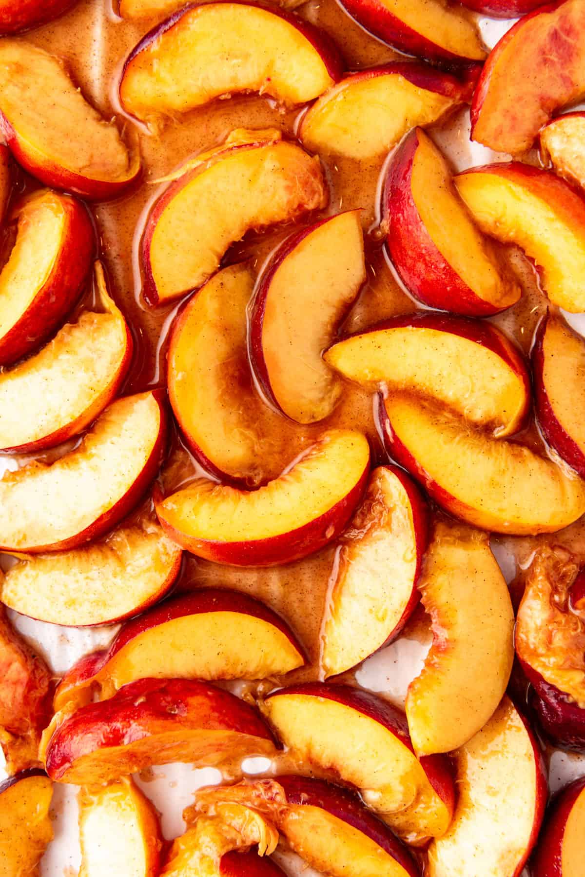 A close up image of sliced roasted peaches.