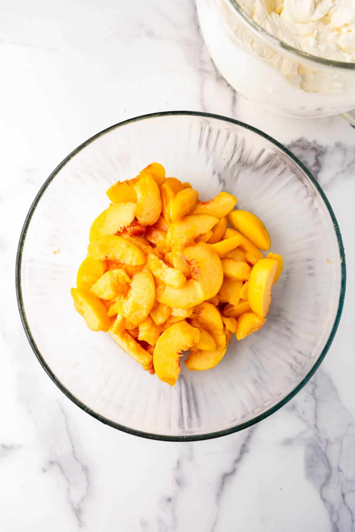 Sliced fresh peaches in a bowl.