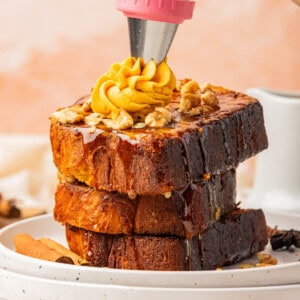 A stack of pumpkin french toast with whipped pumpkin butter.