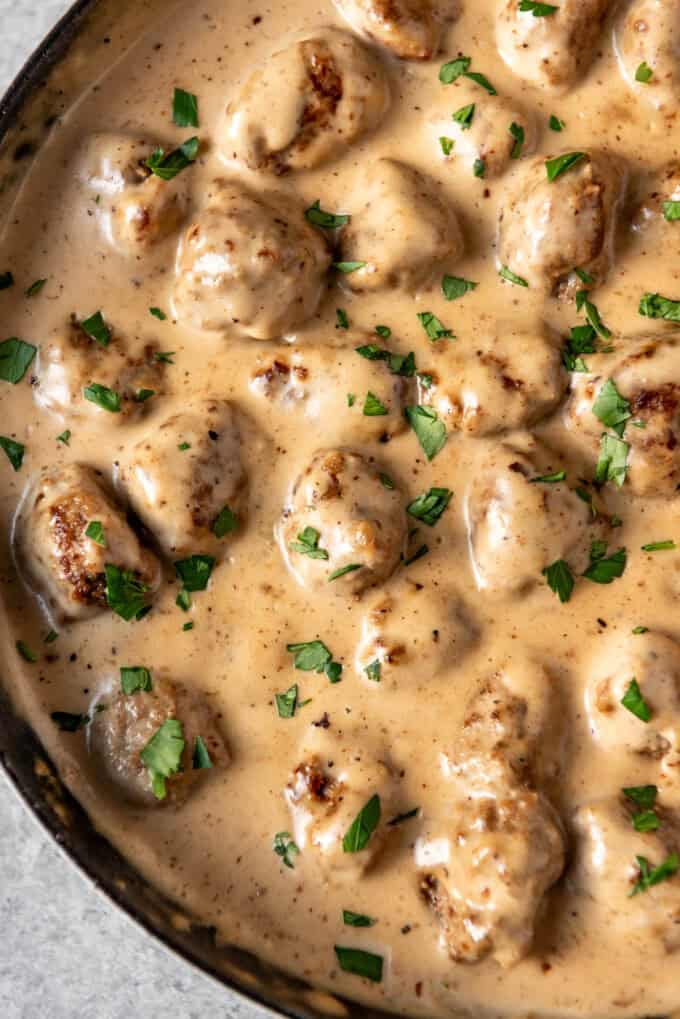 A close image of Swedish meatballs in gravy.