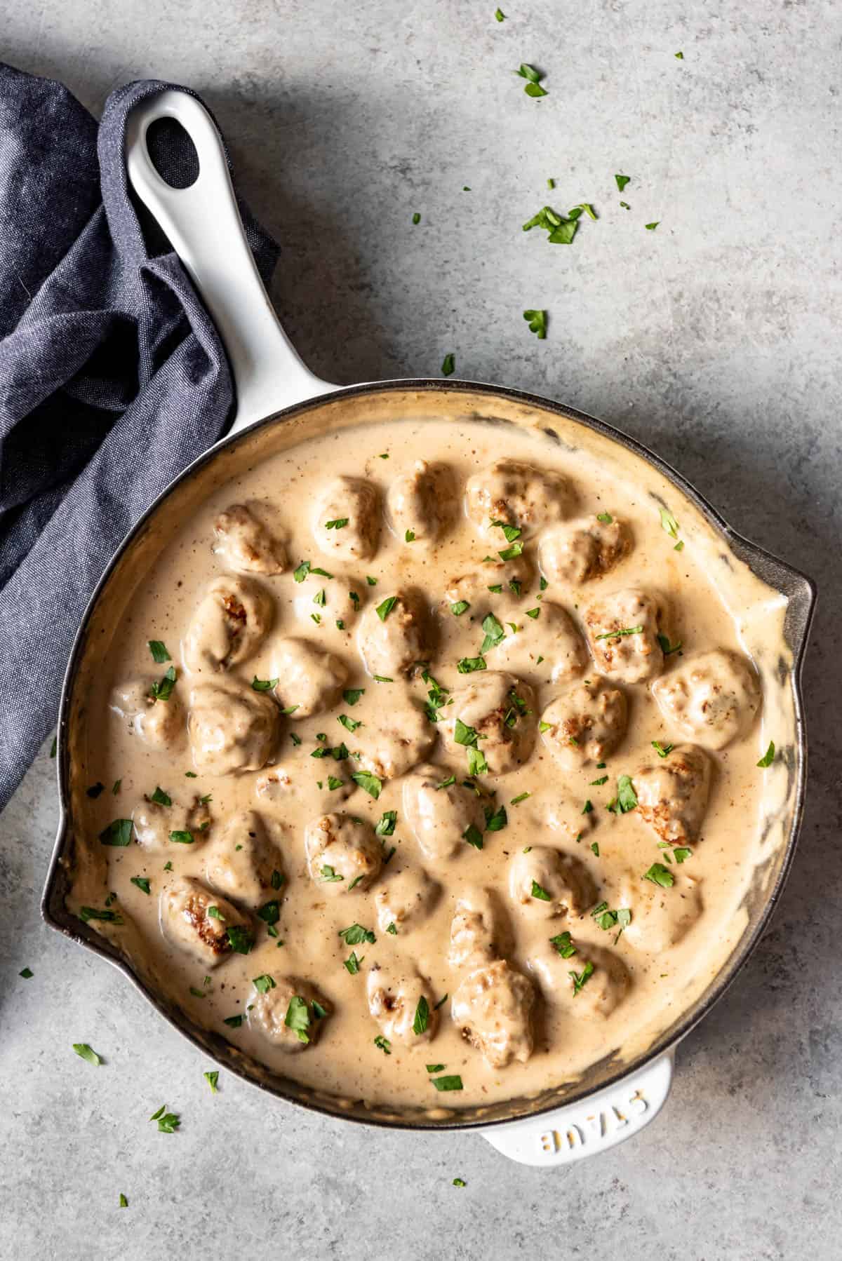 An image of Swedish meatballs in a creamy gravy.