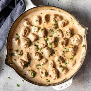 An image of Swedish meatballs in a creamy gravy.