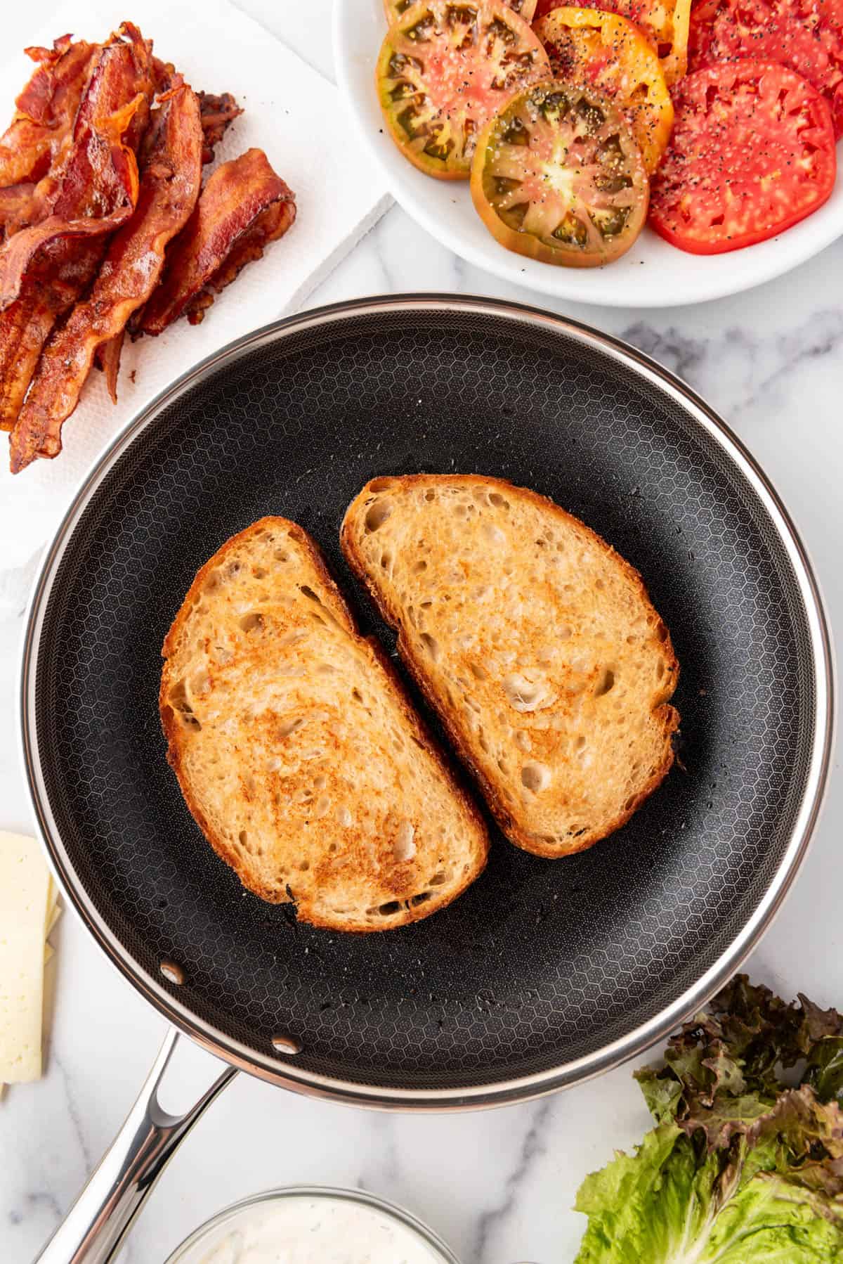 Toasted slices of bread in a frying pan.