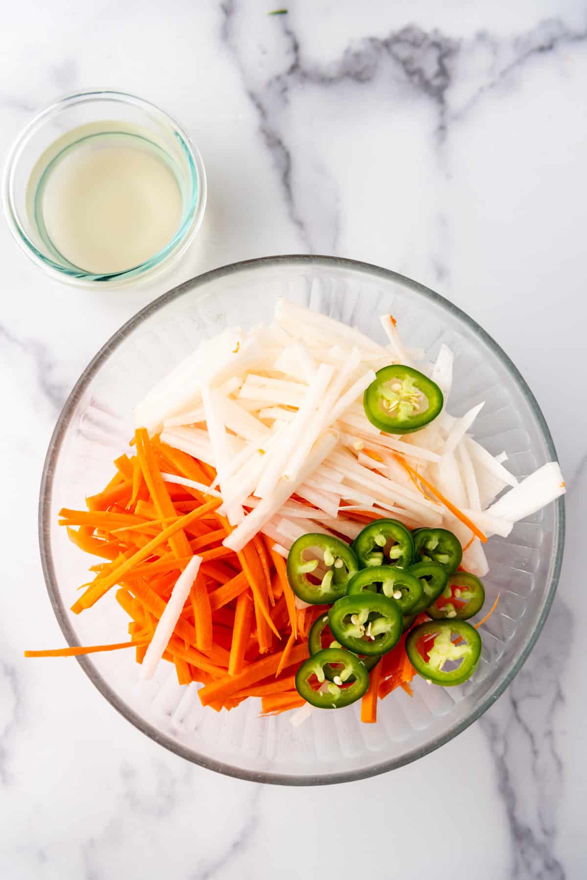 Making pickled vegetables for a banh mi.