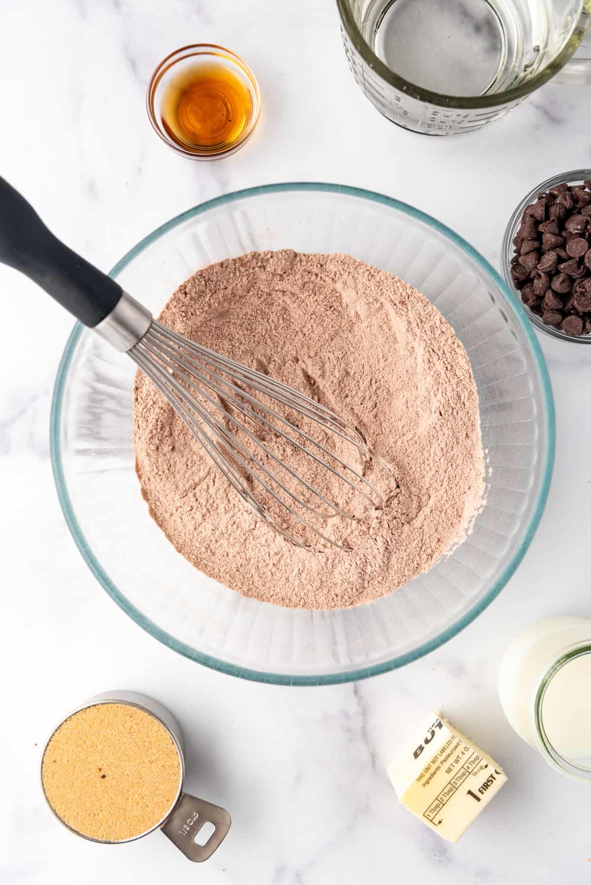 Whisked dry ingredients in a glass bowl.