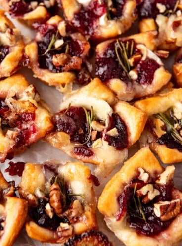 A close image of cranberry brie bites made with crescent roll dough.