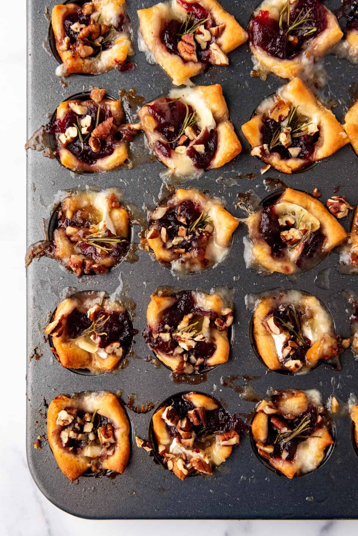 An overhead image of baked cranberry brie bites.