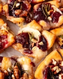 A close image of cranberry brie bites made with crescent roll dough.