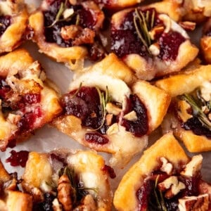 A close image of cranberry brie bites made with crescent roll dough.