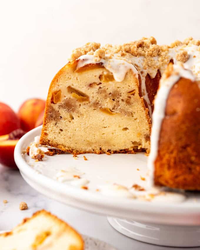 A side view of a cross section of a peach bundt cake.