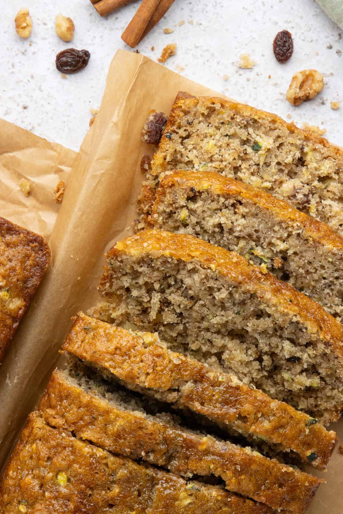 A close overhead image of moist pineapple zucchini bread cut into slices.