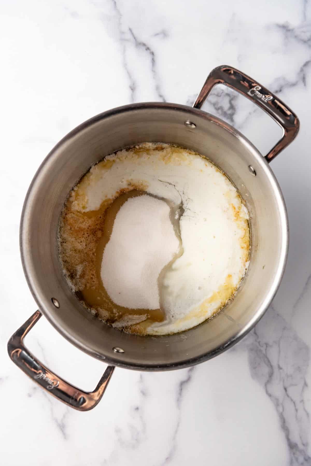 Combining sugar, melted butter, and buttermilk in a large pot.