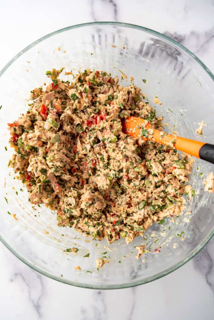 Salmon Cake patty mixture in a glass mixing bowl.