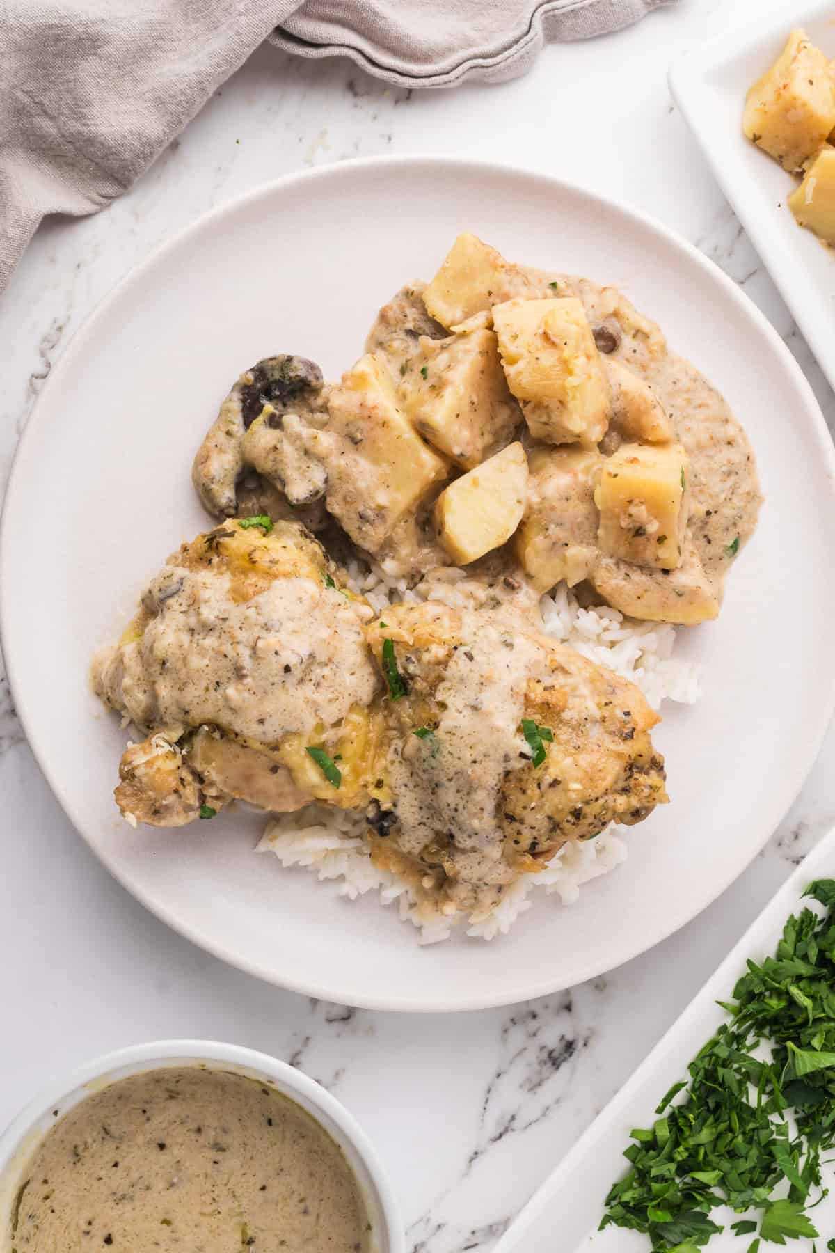 An overhead image of garlic parmesan chicken on a plate.