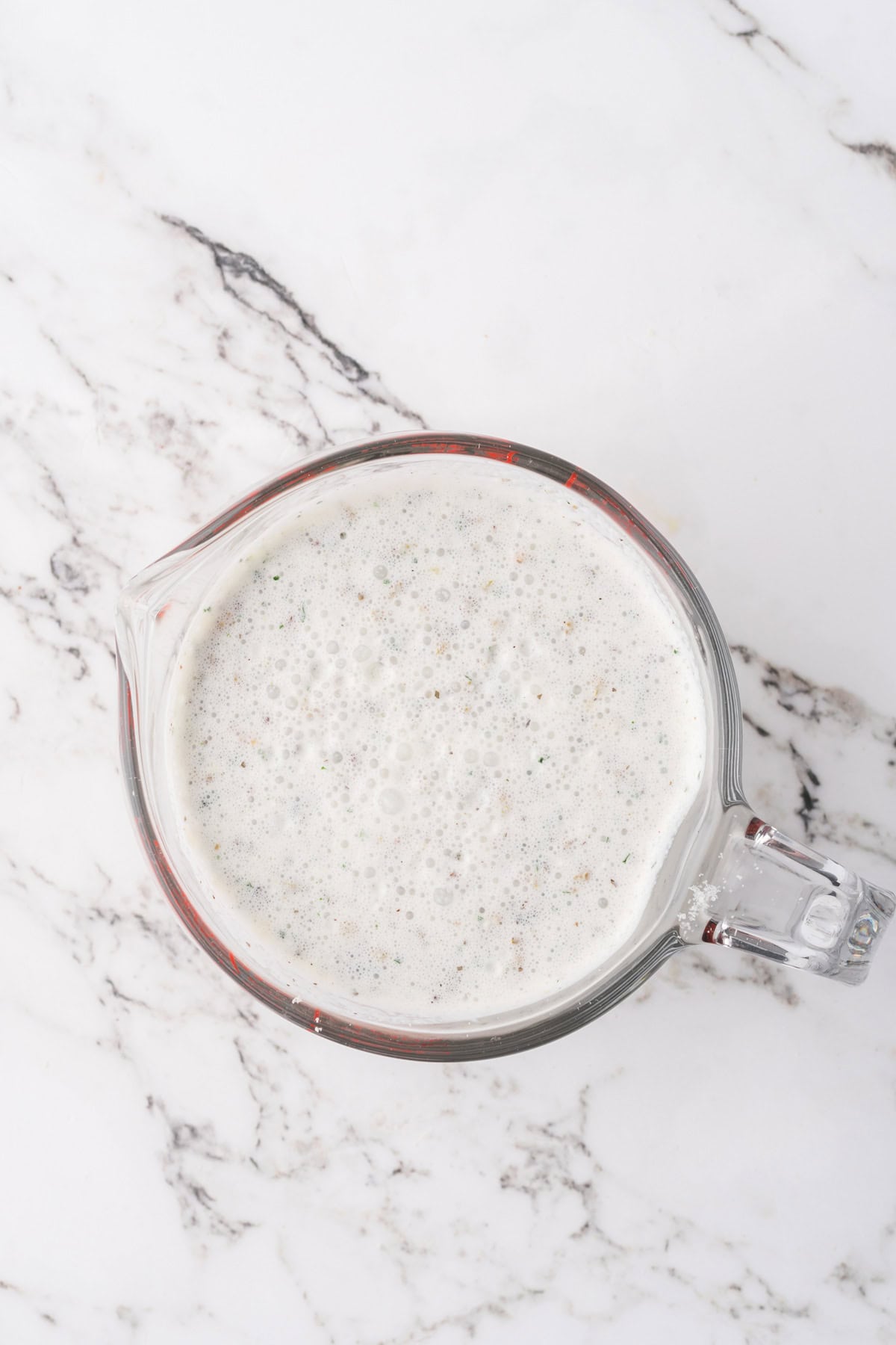 The sauce for a slow cooker chicken garlic parmesan recipe.